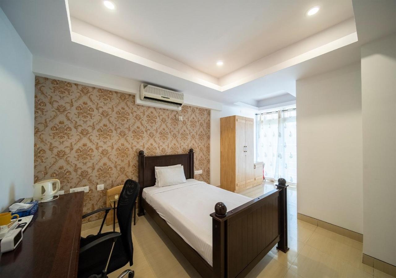 Capital O 46966 Apollo 27 Hotel Бангалор Екстериор снимка